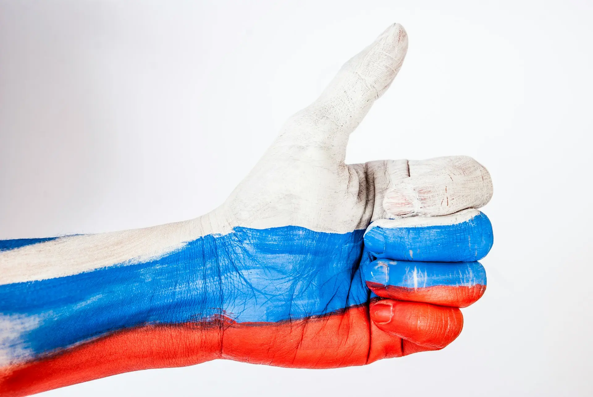 persons hand with blue paint